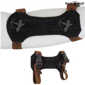 The Buck Trail Traditional Armguard in black, shown on an archer's forearm. The 18 cm long armguard, made of leather and reinforced with steel, offers superior protection and a comfortable fit for traditional archery enthusiasts.